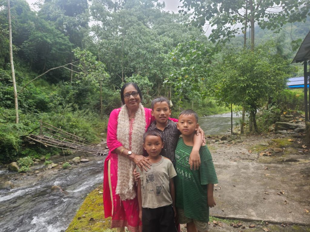 My mom with local kids
